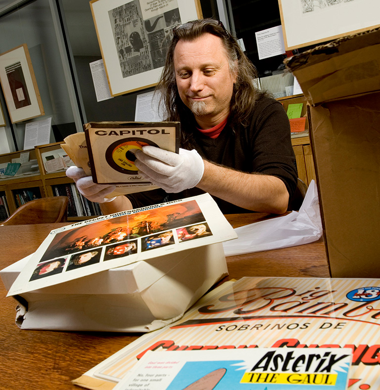 Matt WRibican sorting through a box from Andy Warhol's Time capsules