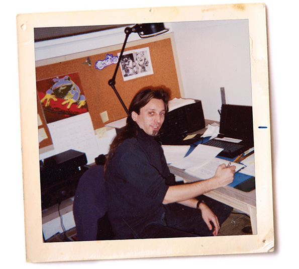 A vintage polaroid photo of Matt Wribican working at a desk.
