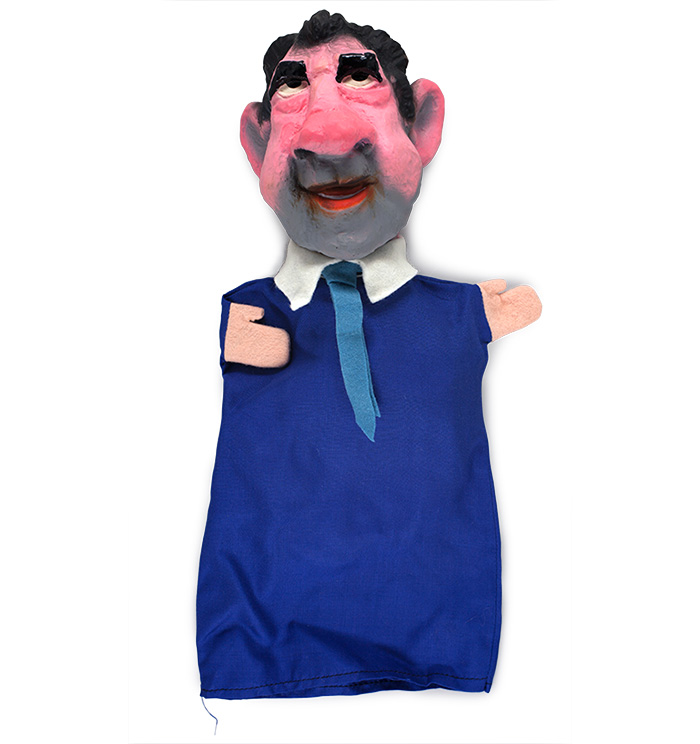 A hand puppet depicting Richard Nixon.