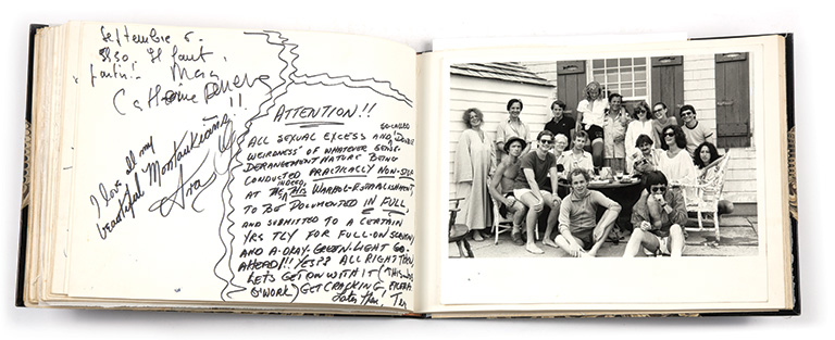 A scrapbook open to a page showing a group of people posing for a photograph.