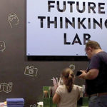 Museum visitors exploring an exhibit.