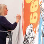 Conservator working on a piece of Warhol's artwork