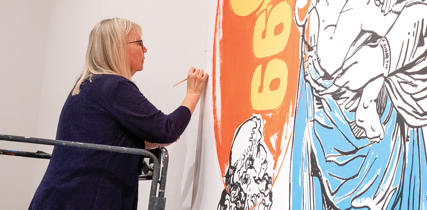 Conservator working on a piece of Warhol's artwork