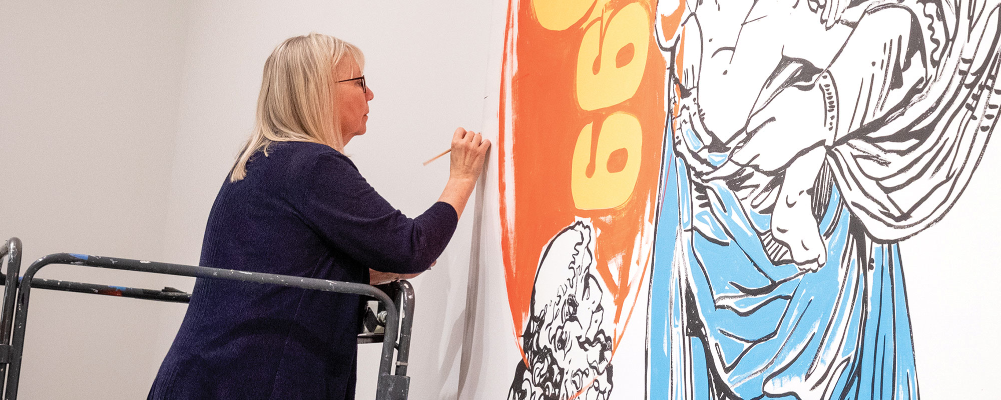 Conservator working on a piece of Warhol's artwork