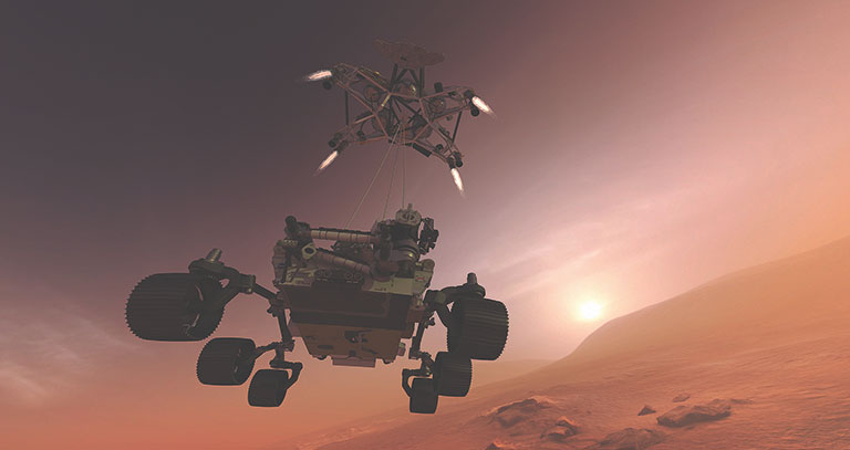 THe Mars Rover being lowered to the surface