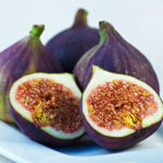 A group of figs on a plate