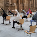 Seniors participating in chair yoga