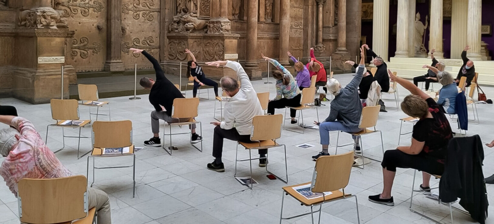 Seniors participating in chair yoga