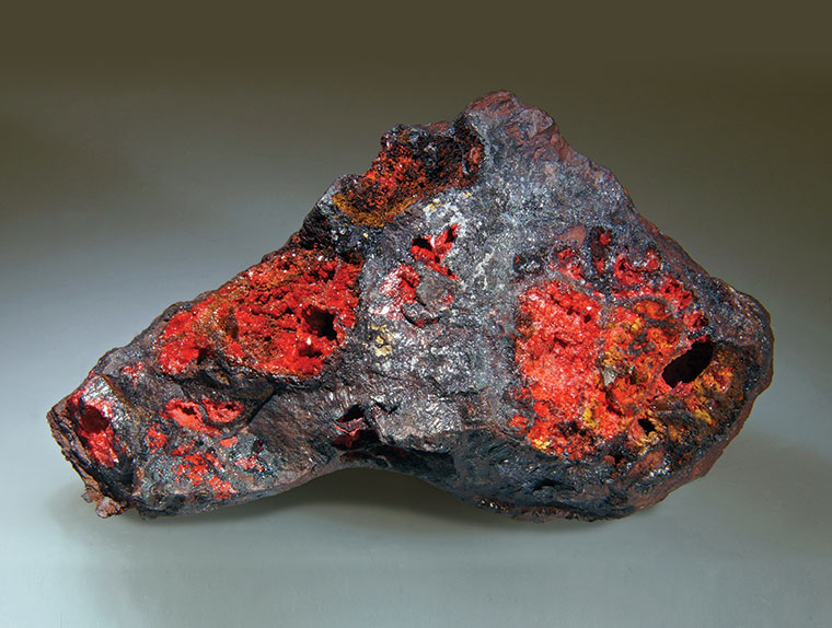 A gray and red colored mineral