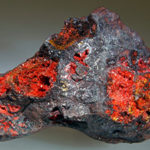 A gray and red colored mineral