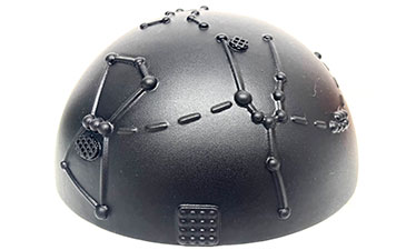 A black helmet with tactile, raised lines and patterns resembling constellations. The design is intricate, suggesting a futuristic or tech-inspired theme.